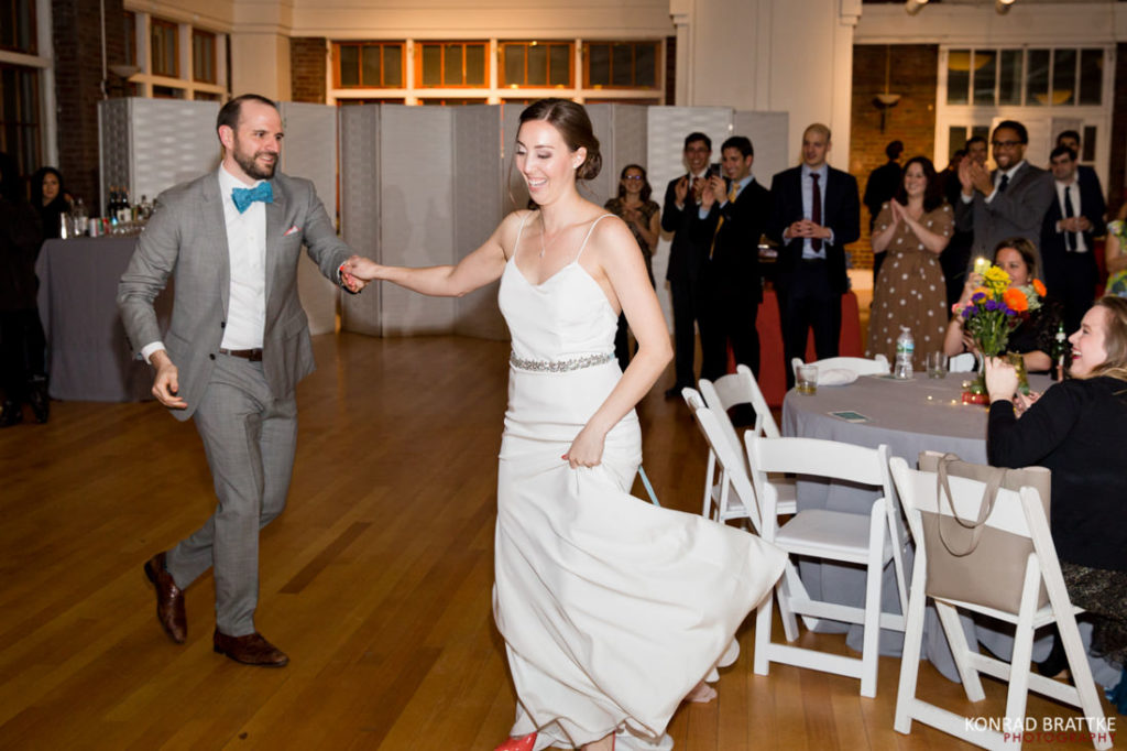 A bride and groom are dancing at the picnic house at prospect park.