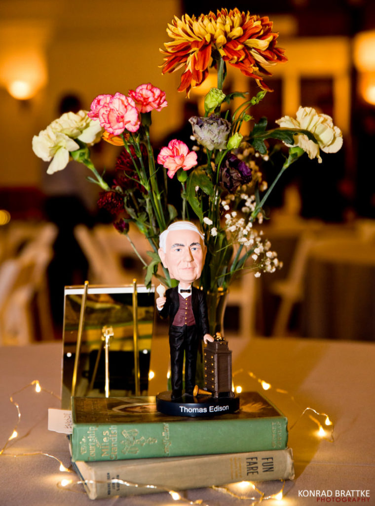 A vase of flowers on a table at a Prospect Park Wedding.