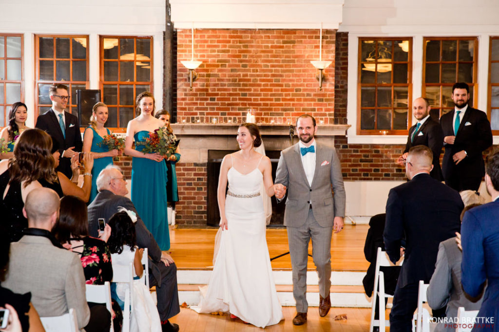A bride and groom walking down the aisle at their Prospect Park wedding.