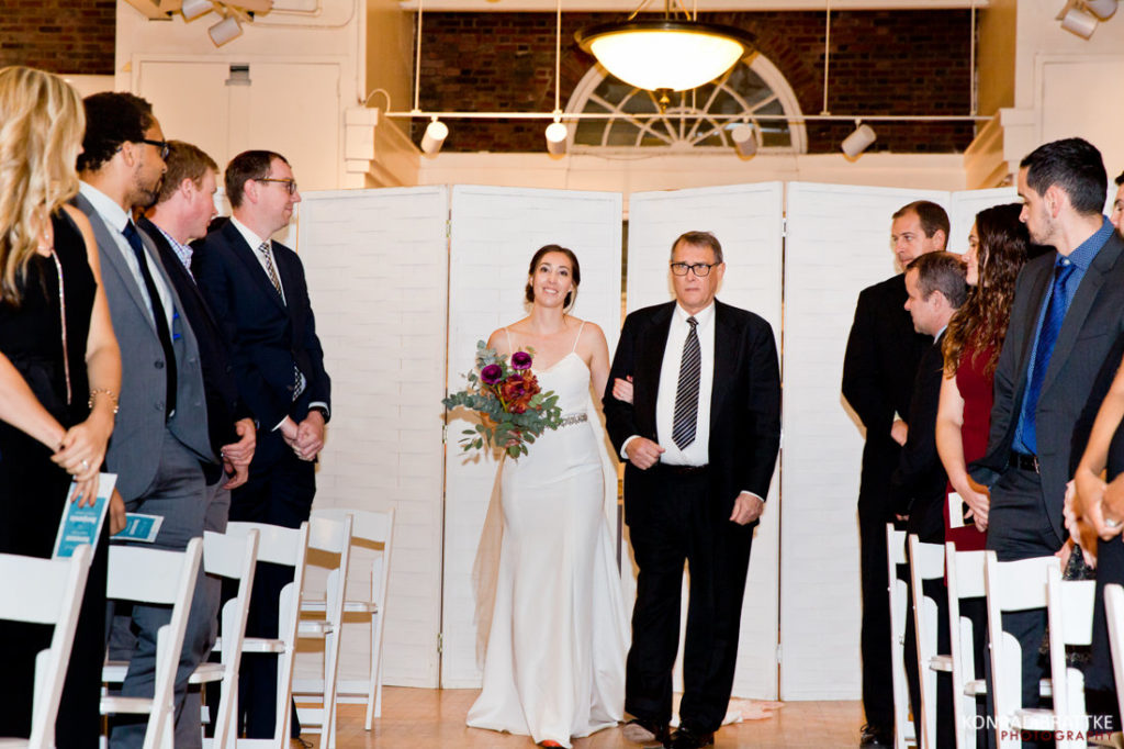 A Prospect Park wedding ceremony captures the magical moment of a bride and her dad joyfully walking down the aisle.