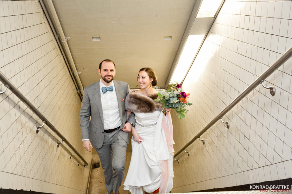 A Prospect Park Wedding, with the bride and groom gracefully walking down an escalator.