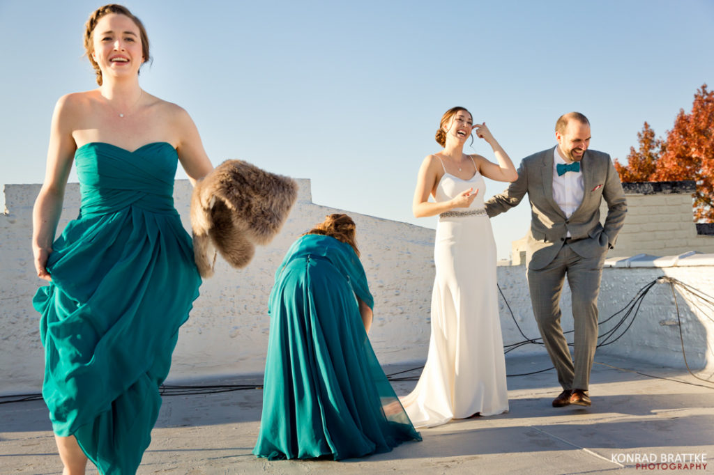 The bridesmaid is wearing a blue dress.