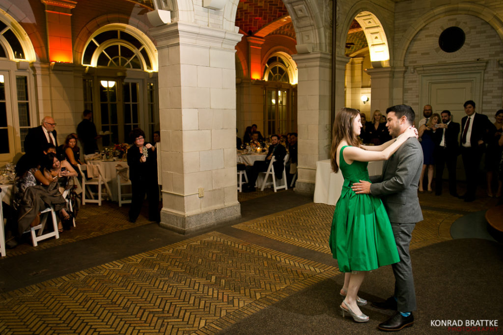 A bride and groom sharing their first dance at a Boathouse Wedding.
