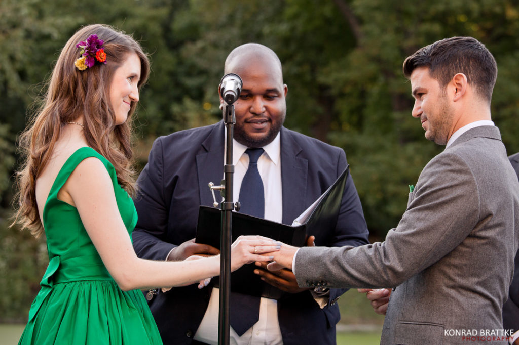 A bride and groom exchanging their vows at a Boathouse Wedding in Prospect Park.
