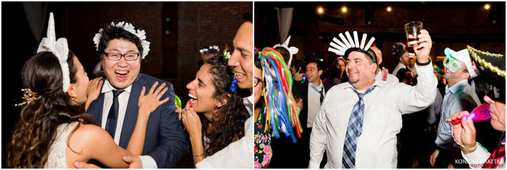 A group of people at a wedding wearing hats at 26 Bridge.