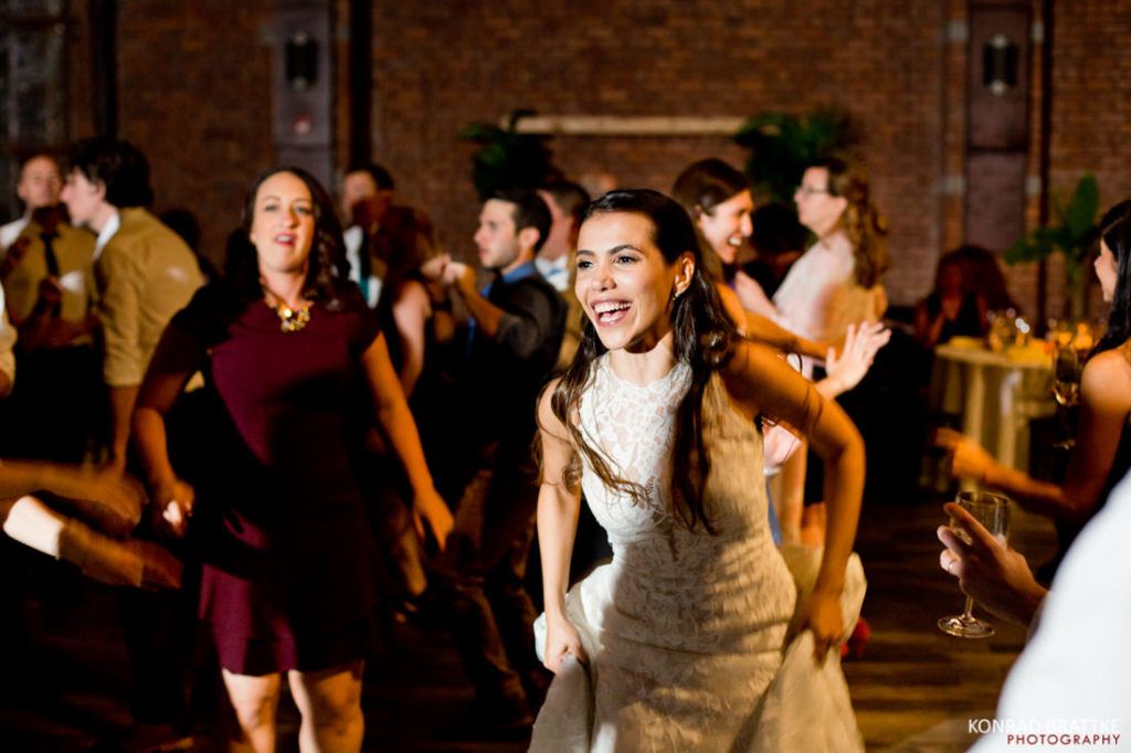 A couple blissfully dances at the 26 Bridge wedding reception.