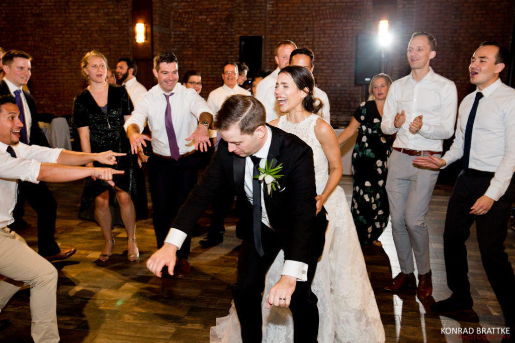 A bride and groom dancing at the 26 Bridge wedding reception.