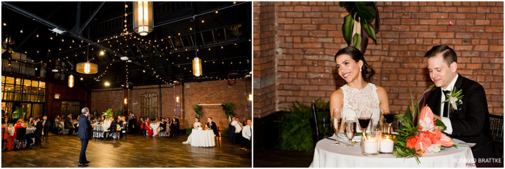 A bride and groom sitting at a table at the 26 Bridge wedding reception.