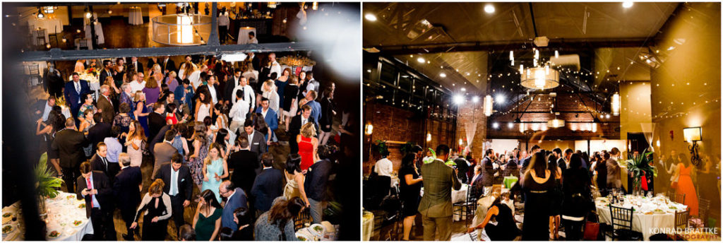 A group of people are dancing in a large room at 26 Bridge.