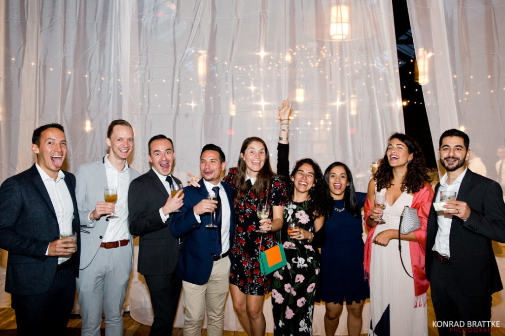 A group of people posing for a photo at 26 Bridge party.