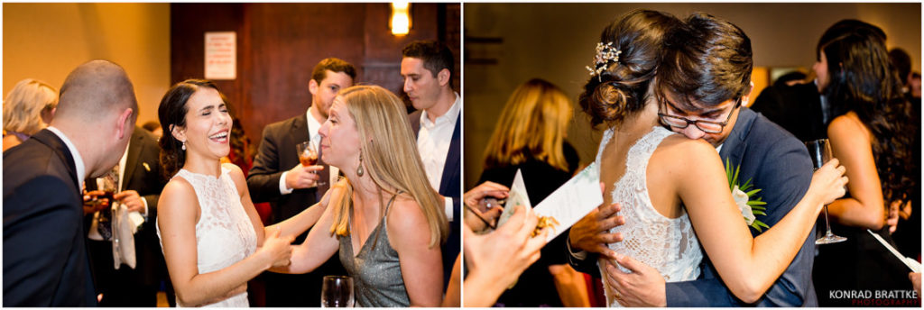 A bride and groom hugging at 26 Bridge, a wedding reception.