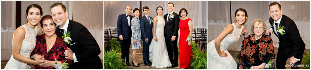 A group of people posing for a wedding photo at 26 Bridge.
