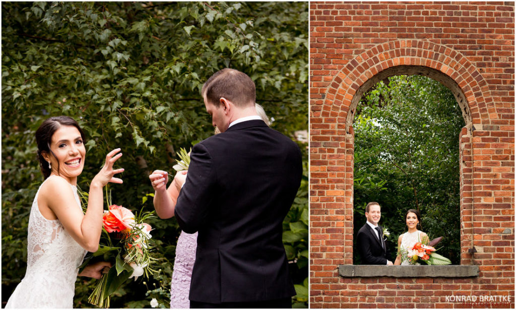 A bride and groom sharing a passionate kiss in front of a stunning brick wall backdrop.