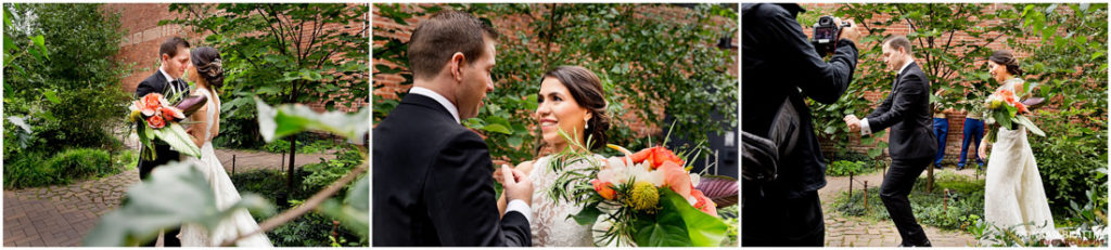 A bride and groom kissing in front of the 26 Bridge.