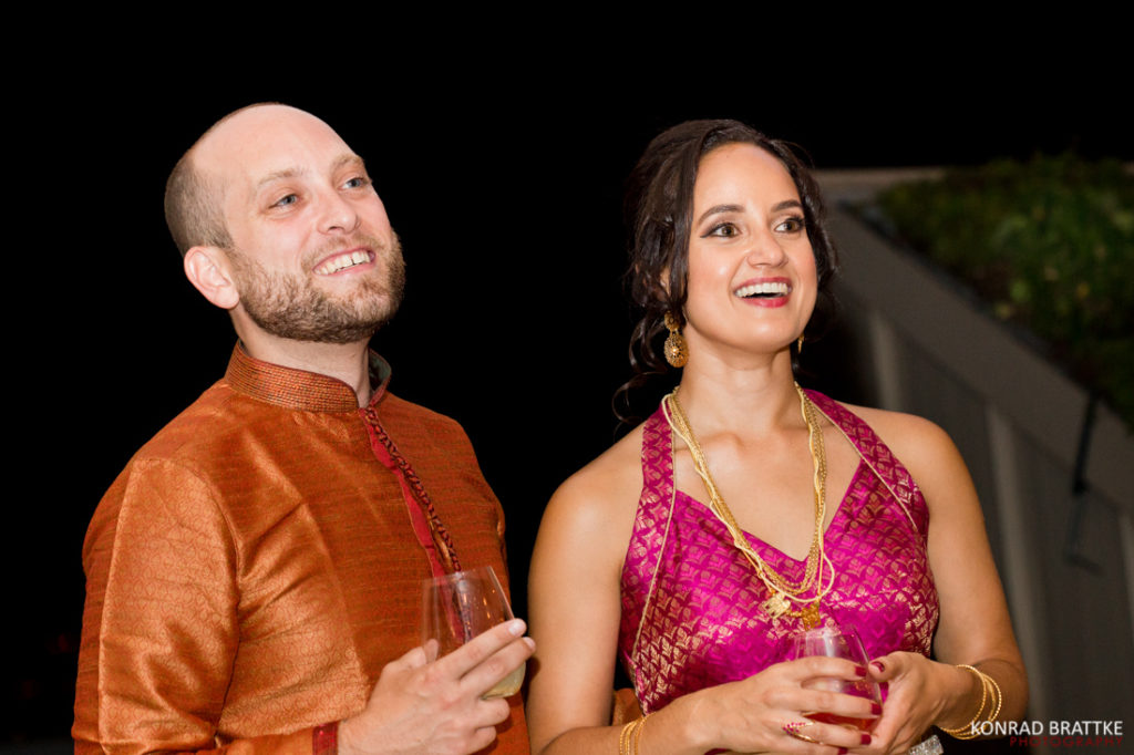 A Brooklyn Grange wedding captured a bride and groom elegantly holding wine glasses.