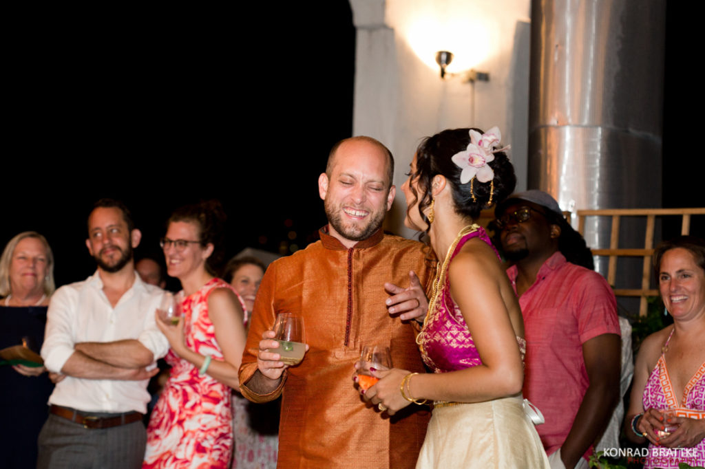 A bride and groom enjoying wine at a Brooklyn Grange wedding reception.