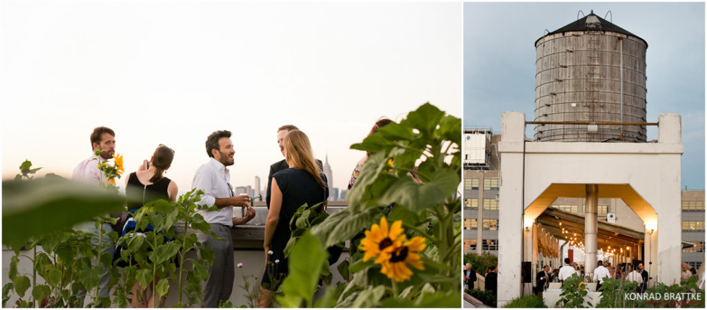 A group of people standing in front of a water tower at a Brooklyn Grange wedding.