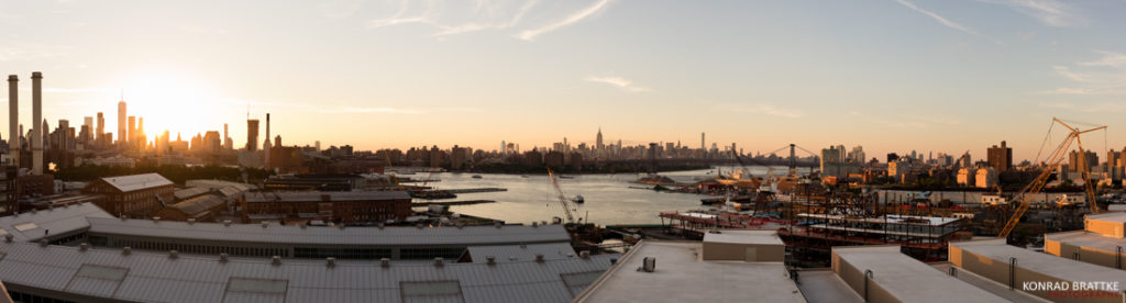 A breathtaking panoramic view from Brooklyn Grange at sunset, featuring the stunning skyline of Brooklyn.