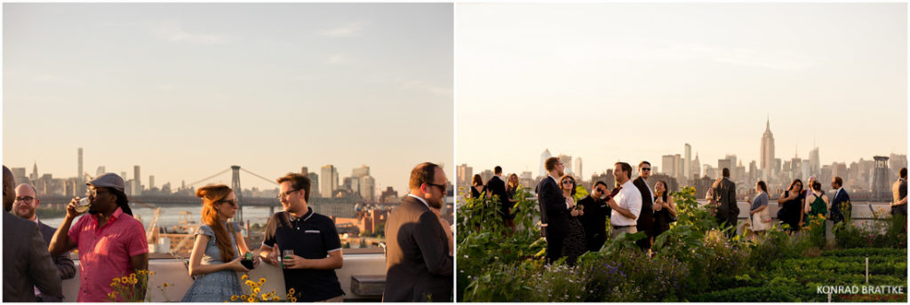 A group of people are standing on a rooftop with a view of the city at a Brooklyn Grange wedding.