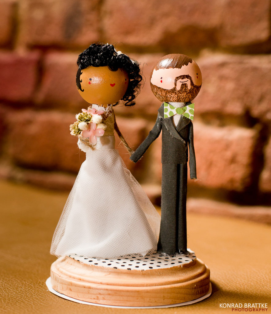 A brooklyn wedding cake topper with a bride and groom.