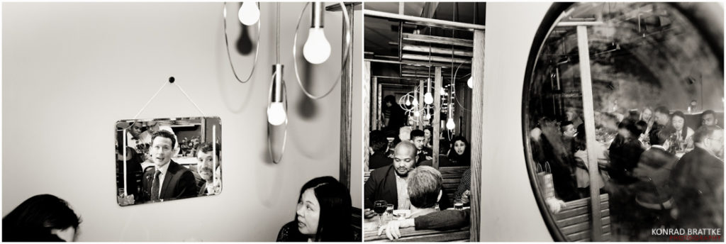 A black and white photo of a mirror with people in it at Le Fanfare.