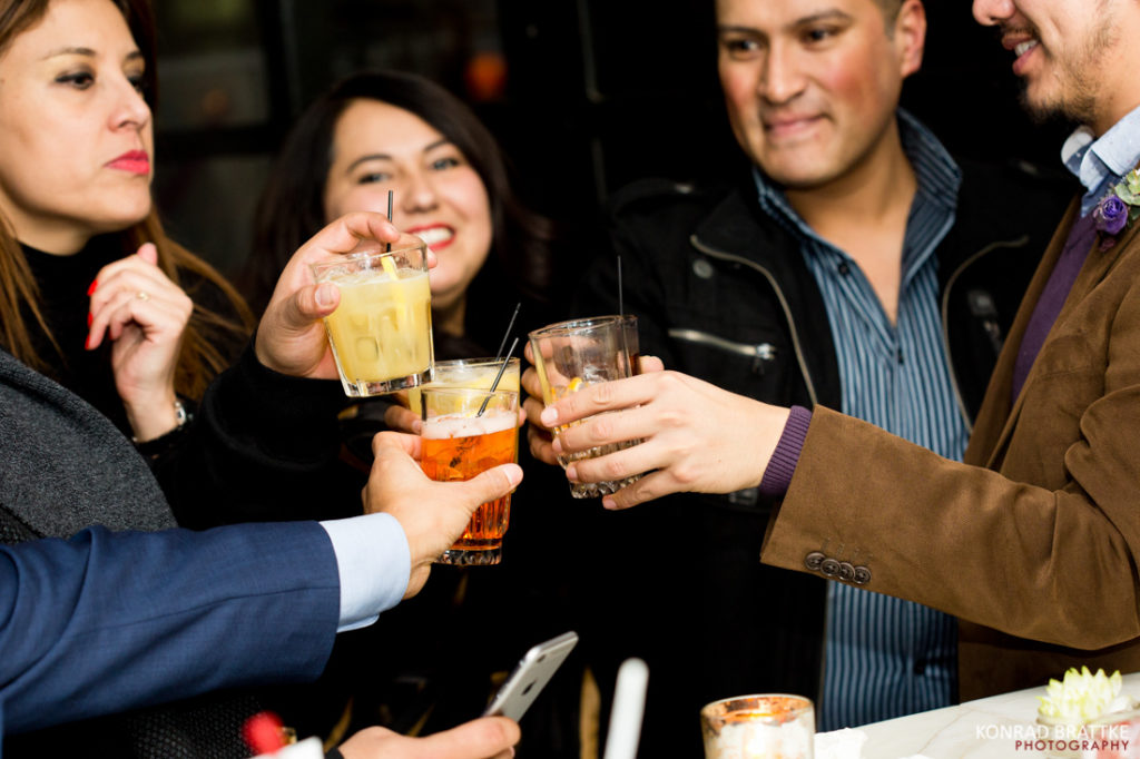 A group cheering at a Le Fanfare wedding.