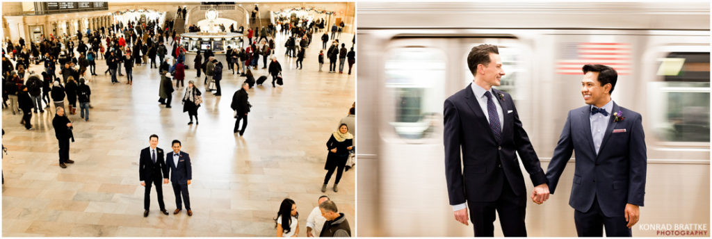 Two men in suits standing next to each other in a subway station.