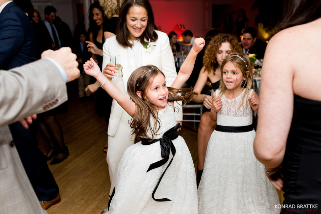 A group of girls dancing at a Manhattan Penthouse wedding reception.
