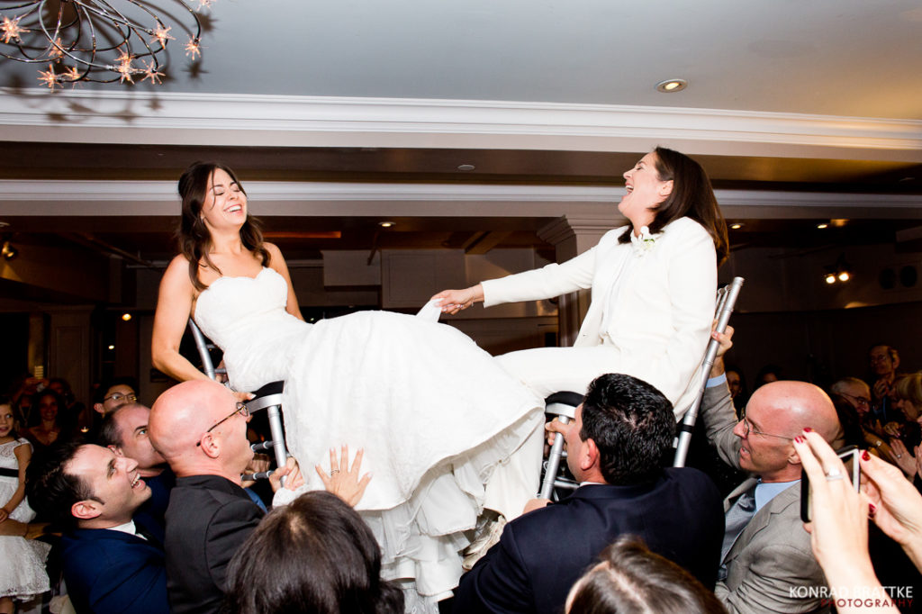 Two brides are being carried up on a MANHATTAN PENTHOUSE wedding.