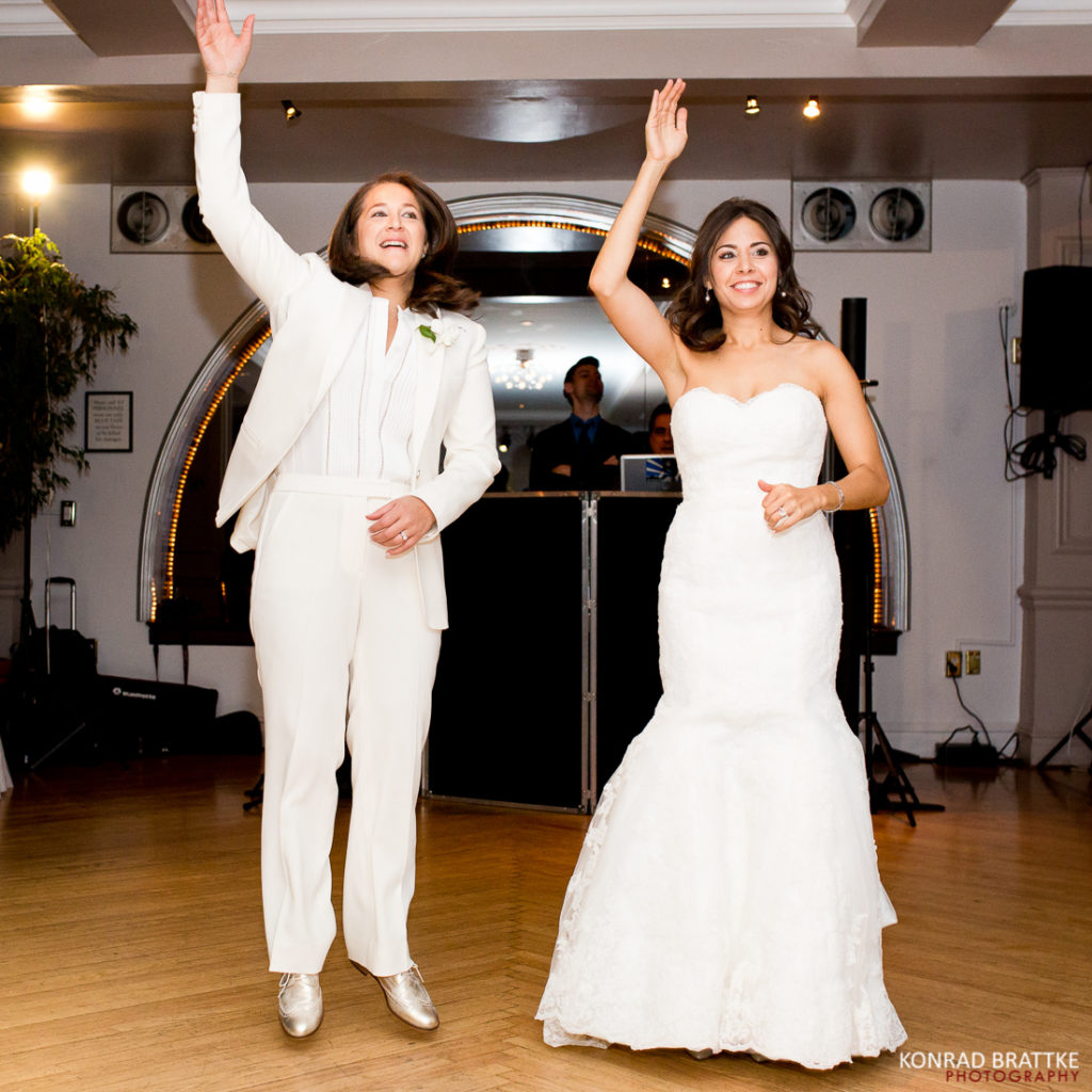 In the elegant Manhattan Penthouse, the brides are beautifully adorned in a stunning white dress.