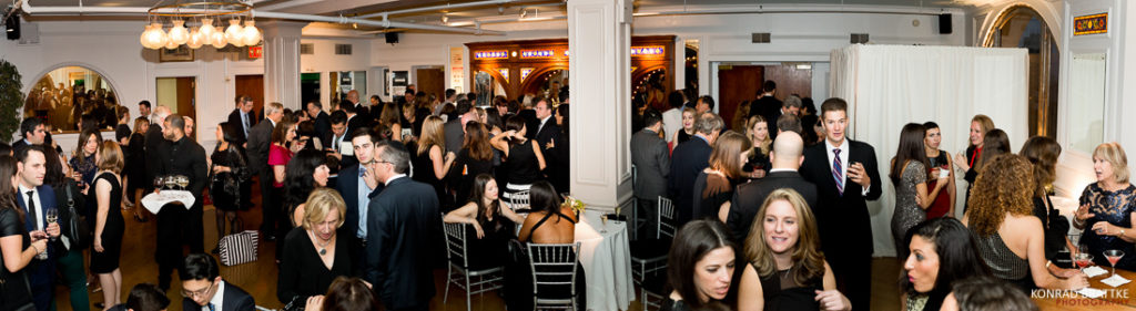 A group of people gathering in a Manhattan penthouse.