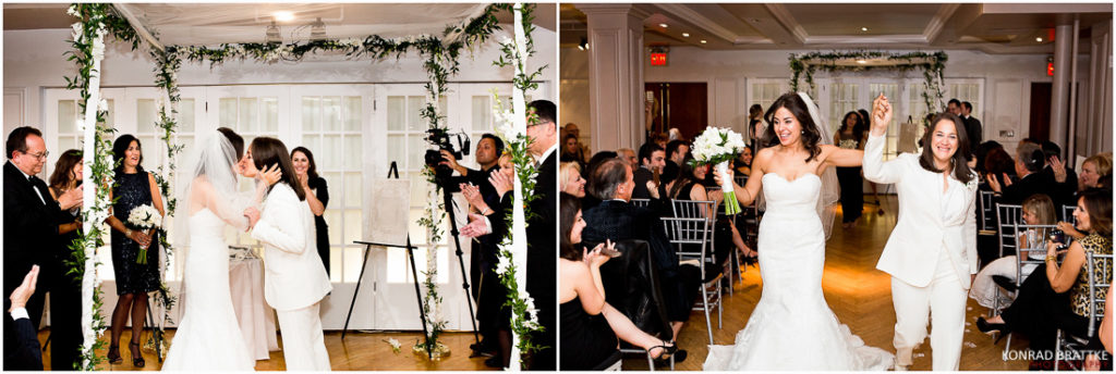 A Manhattan Penthouse wedding ceremony features a radiant bride triumphantly walking down the aisle, surrounded by joyous family and friends.