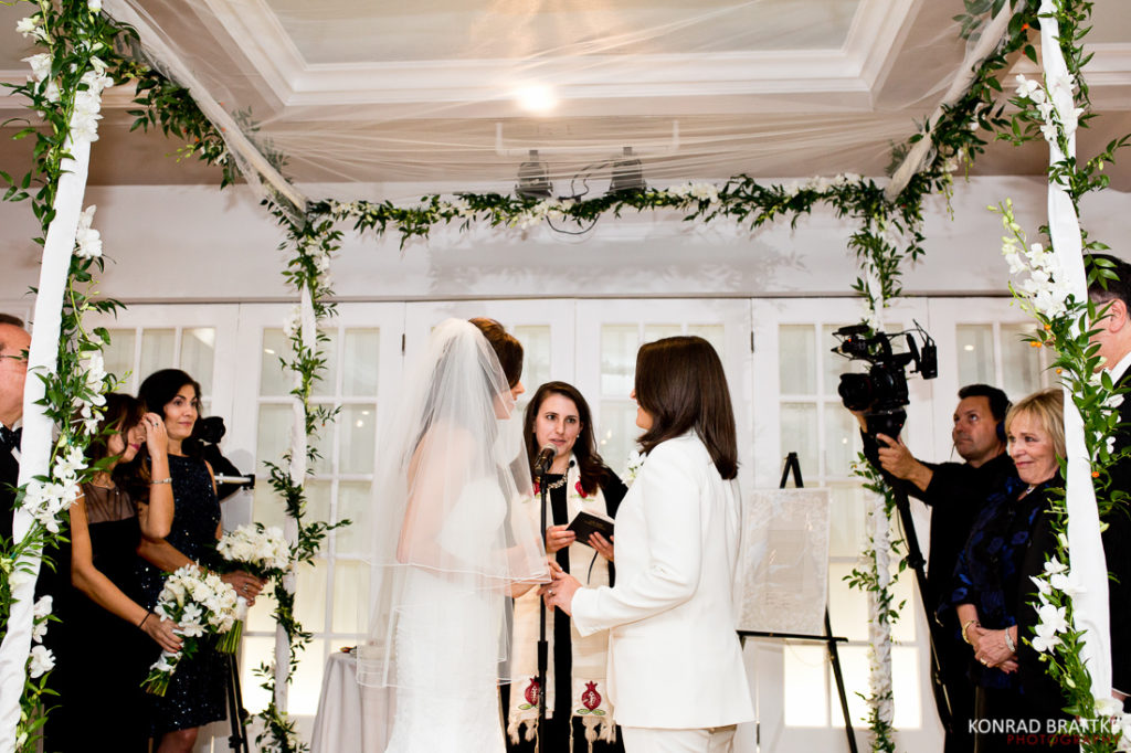 Two brides exchange vows in a Manhattan Penthouse wedding ceremony.