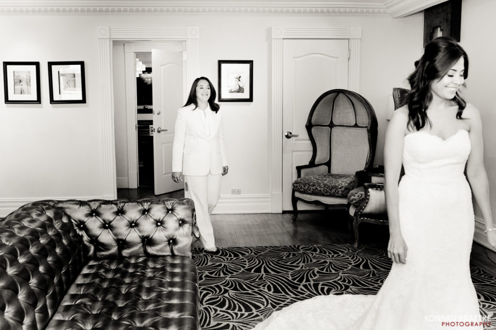 A woman in a wedding dress is standing in a Manhattan penthouse.