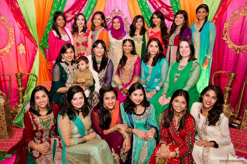 A group of Indian women showcasing their beautiful mehndi designs at Antuns.
