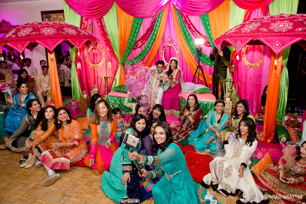 A group of Indian women at Mehndi at Antuns posing for a photo.