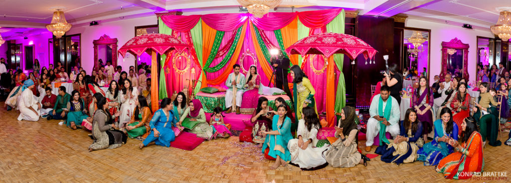 A group of people posing for a photo at an Indian wedding's mehndi ceremony at Antun's.