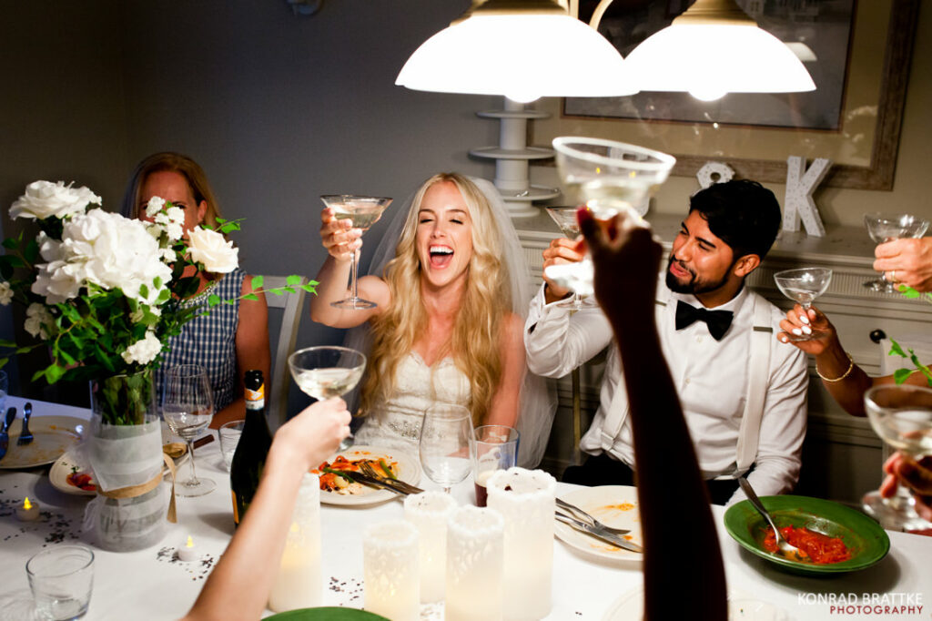 The best of weddings, a group of people toasting at a table.