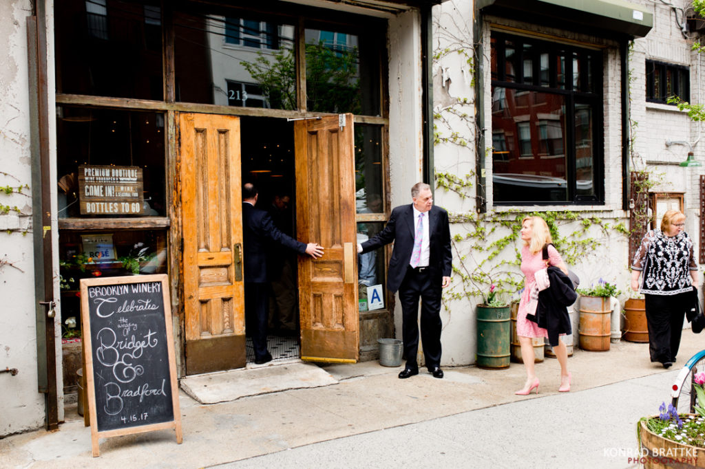 A group of people standing outside of Brooklyn Winery.