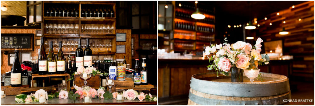 A wine barrel adorned with vibrant flowers and accompanied by a bottle of wine, reminiscent of the charming ambiance found at Brooklyn Winery.