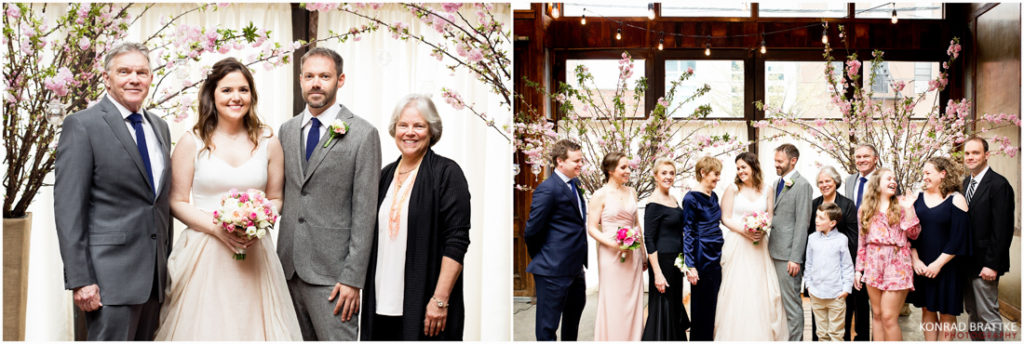 A group of people posing for a picture during a wedding at the Brooklyn Winery.