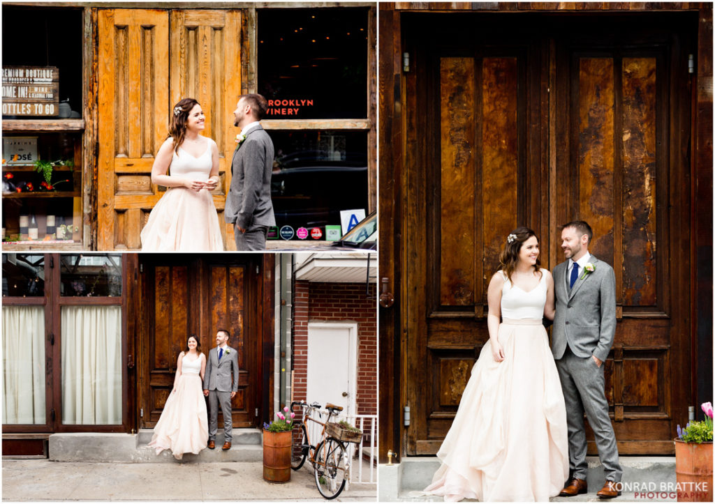 A bride and groom posing elegantly in front of the rustic wooden door at Brooklyn Winery.