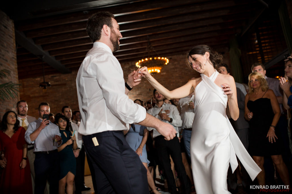 A bride and groom having their first dance at a Bowery Hotel wedding reception.