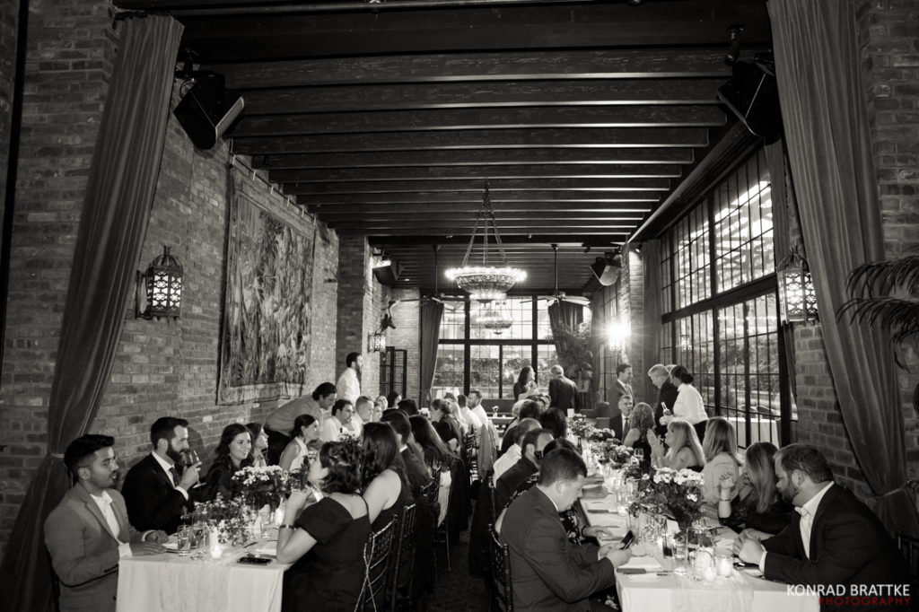A black and white photo of a wedding reception at the Bowery Hotel.
