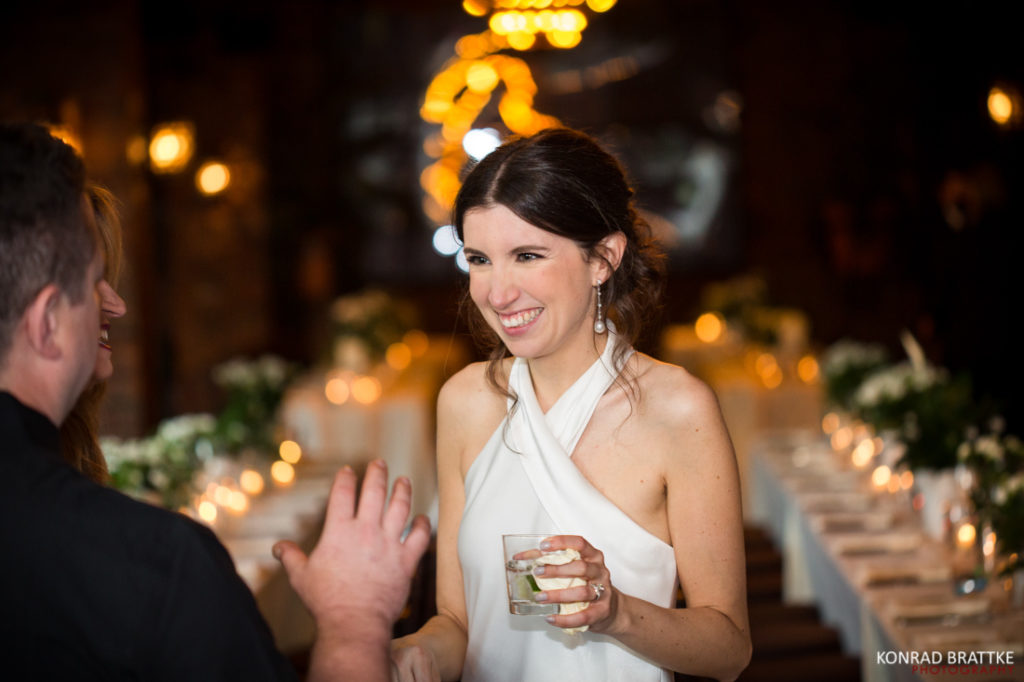 A bride and groom enjoying a drink at their Bowery Hotel wedding reception.