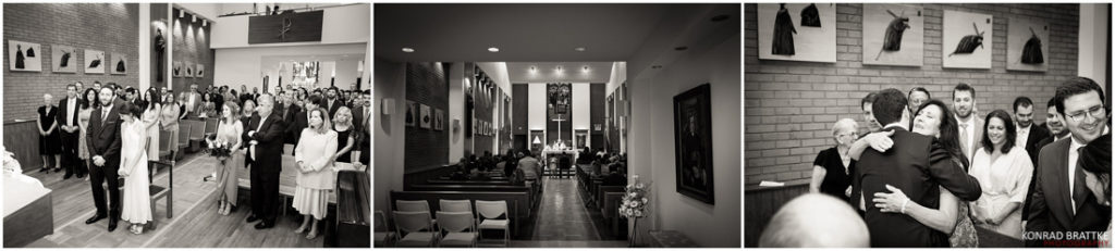 A group of people celebrating a wedding in front of a church.