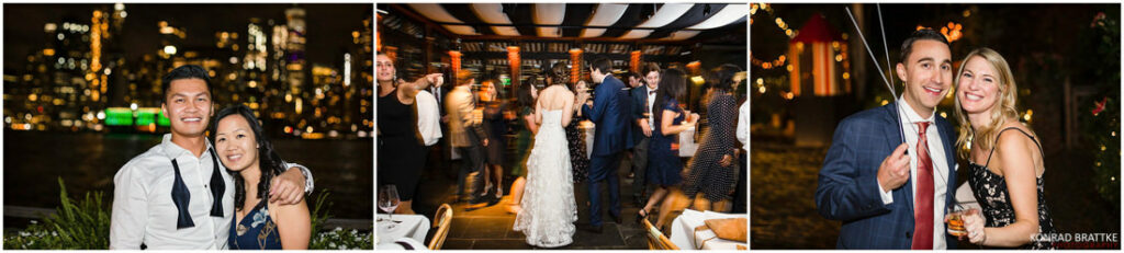 A bride and groom are posing in front of a boat at the River Cafe at night.