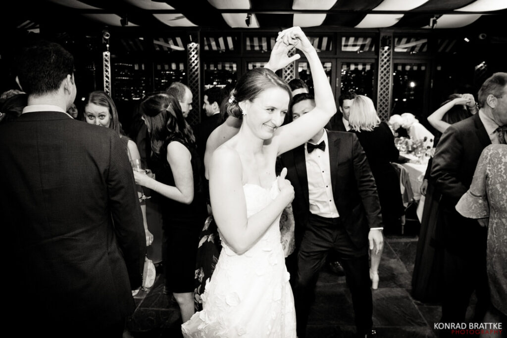 A bride gracefully dancing on the dance floor at a wedding, adorned in her stunning wedding gown.