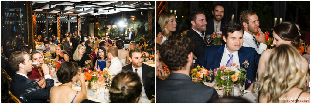 A group of people sitting at a table at a wedding reception held at the River Cafe.