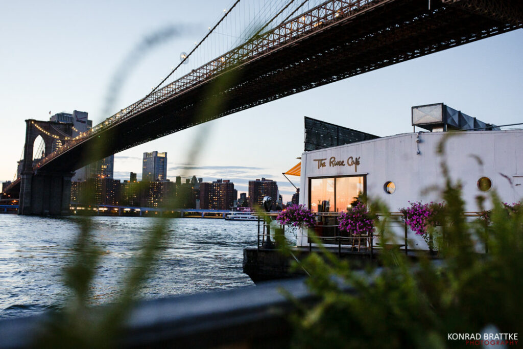 Brooklyn bridge at dusk with the river cafe in the background.